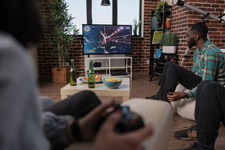 friends-playing-video-games-in-living-room-2026-01-08-02-27-54-utc