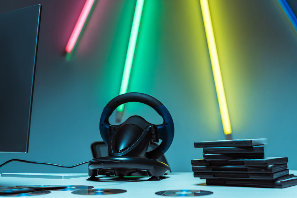 gaming-setup-with-steering-wheel-and-neon-lights-2026-01-06-00-38-30-utc