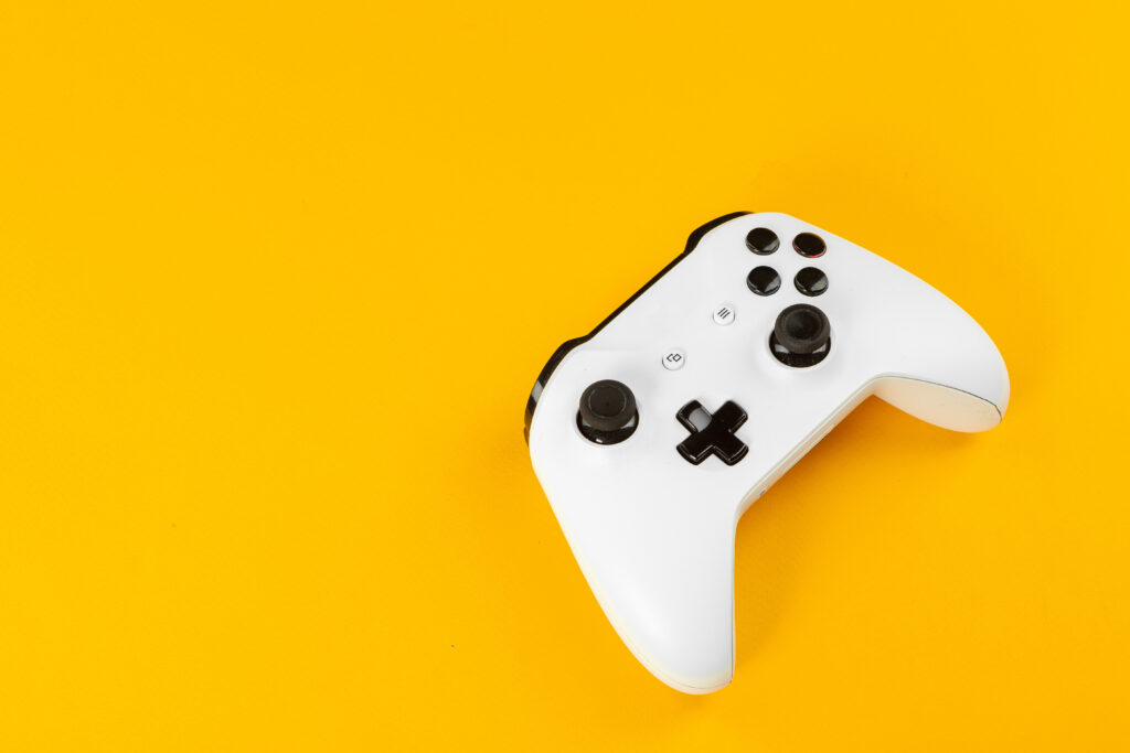 video-game-controller-on-bright-yellow-background-2026-01-08-05-19-32-utc