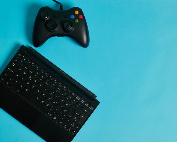gamepad-and-tablet-keyboard-on-blue-background-2026-03-19-21-39-12-utc